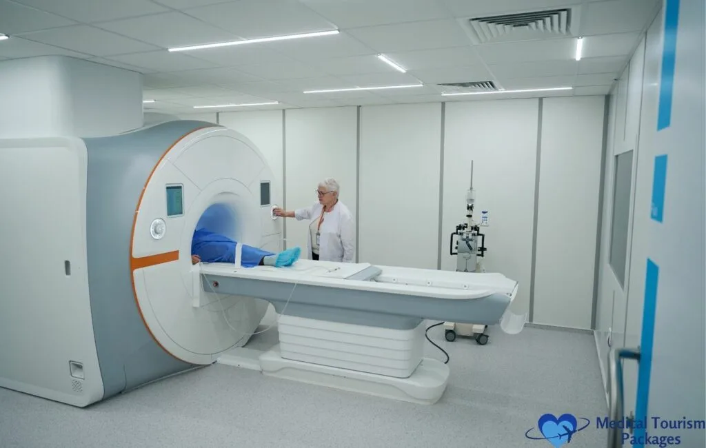 Modern medical facility featuring a state-of-the-art MRI machine with white and orange accents, where a healthcare professional in a white coat tends to a patient lying on the examination table in a clean, well-lit room.