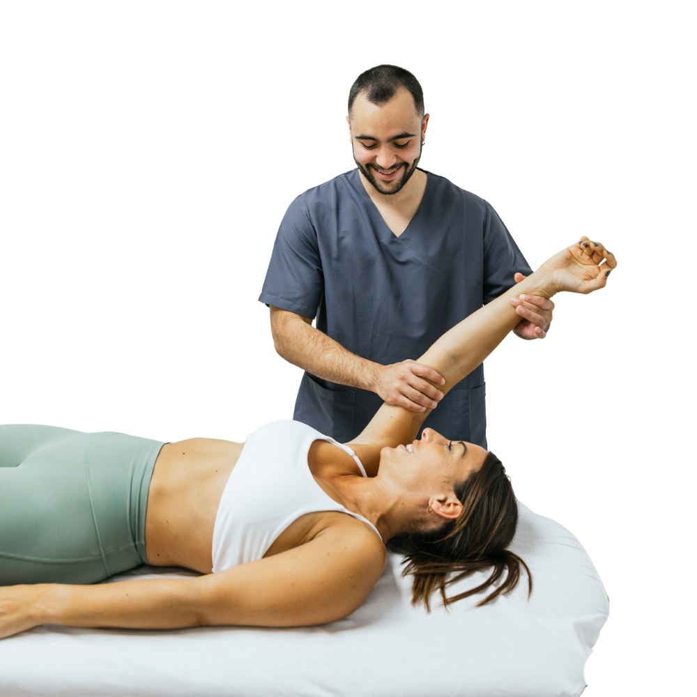 A physical therapist in scrubs assists a woman lying on an exam table by stretching her arm, showcasing the quality care available for medical tourism in Latin America.