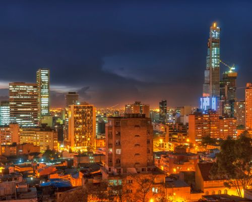 A person using an eye examination device is overlaid with a cityscape at dusk, featuring lit skyscrapers and busy roadways, capturing the allure of medical tourism as cutting-edge care meets vibrant urban exploration.
